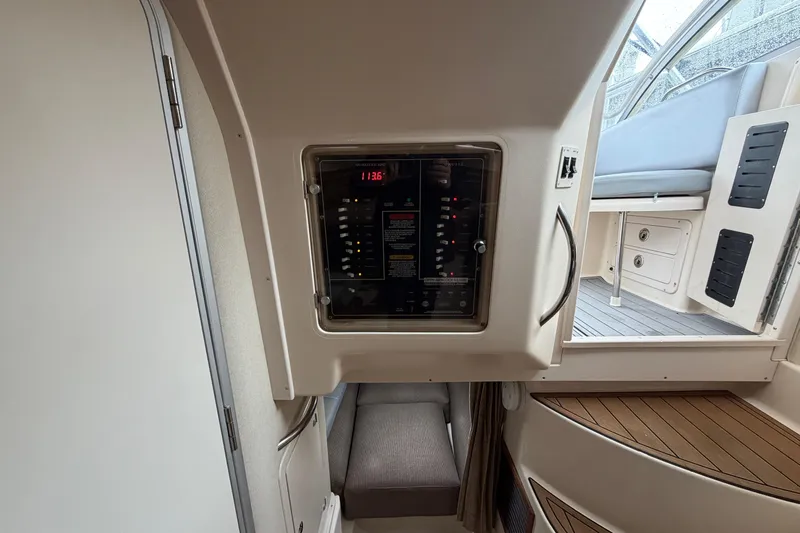  Yacht Photos Pics 2004 Grady-White Express 330 interior with control panel and seating area.