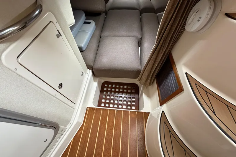  Yacht Photos Pics 2004 Grady-White Express 330 cabin interior with seating and wood flooring.