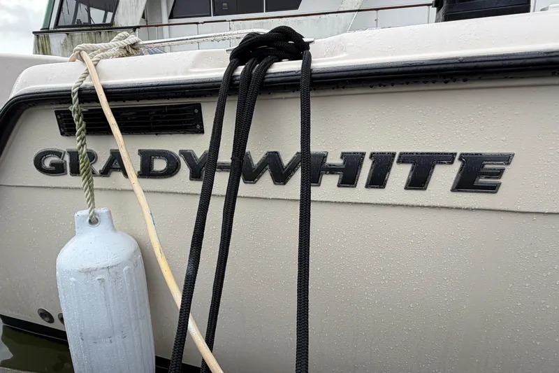  Yacht Photos Pics 2004 Grady-White Express 330 boat with ropes and fender attached.