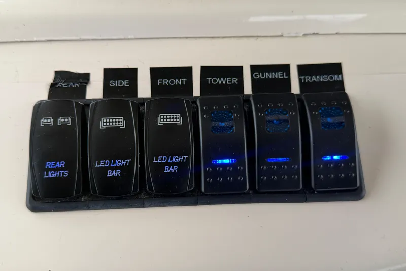  Yacht Photos Pics Control panel with labeled switches for lights on a 2004 Grady-White Express 330 boat.