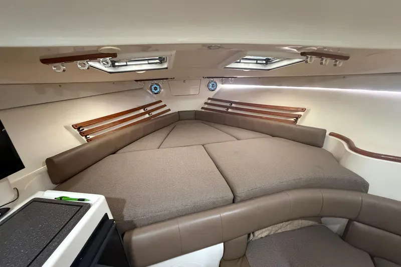  Yacht Photos Pics 2004 Grady-White Express 330 cabin interior with comfortable seating and modern design.