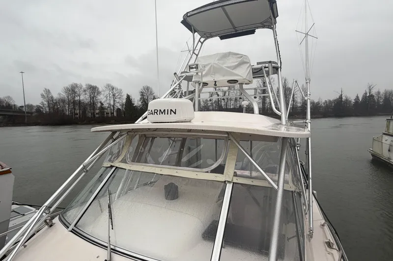  Yacht Photos Pics 2004 Grady-White Express 330 boat with Garmin equipment on a cloudy day.