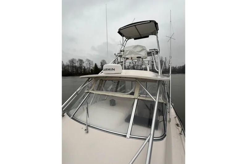  Yacht Photos Pics 2004 Grady-White Express 330 boat with Garmin equipment on a cloudy day.