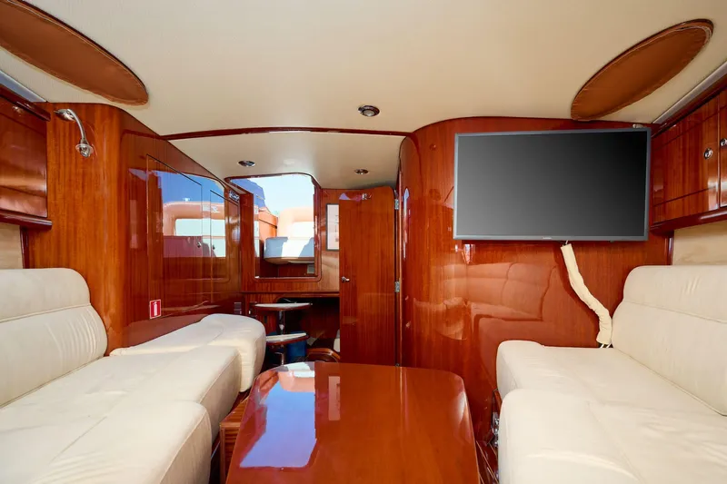  Yacht Photos Pics Luxurious interior of 2010 J Craft Torpedo 42 yacht with wood finish and modern amenities.