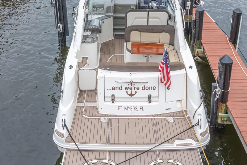  Yacht Photos Pics 2014 Sea Ray 330 Sundancer docked in Ft. Myers, Florida with American flag.