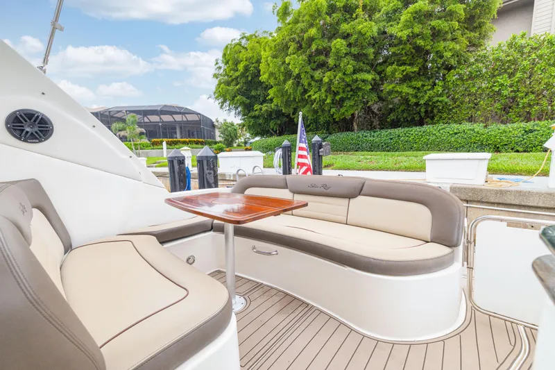  Yacht Photos Pics Luxurious 2014 Sea Ray 330 Sundancer yacht with elegant seating and wooden table.