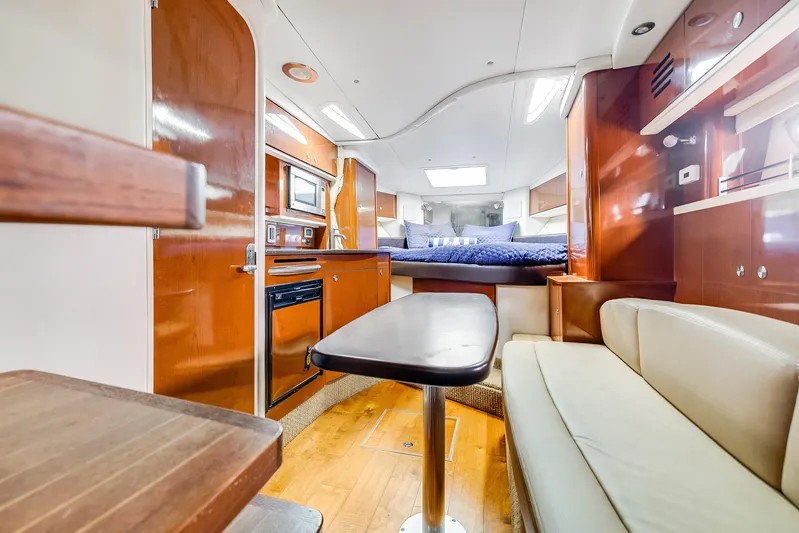  Yacht Photos Pics Luxurious interior of 2014 Sea Ray 330 Sundancer yacht with cozy seating and modern amenities.