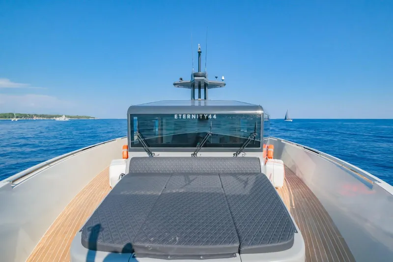 Eternity 44 Yacht Photos Pics Arcadia Yachts 85, 2010 model, cruising on open sea under clear blue sky.