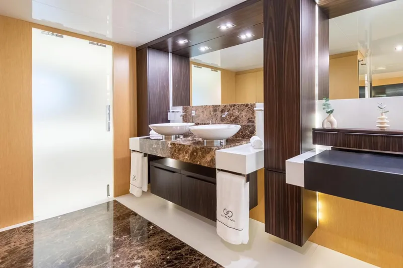 Eternity 44 Yacht Photos Pics Luxurious bathroom interior of 2010 Arcadia Yachts 85 with modern fixtures and elegant design.