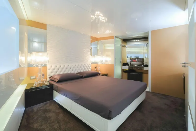 Eternity 44 Yacht Photos Pics Luxurious bedroom interior on 2010 Arcadia Yachts 85, featuring modern design and elegant lighting.