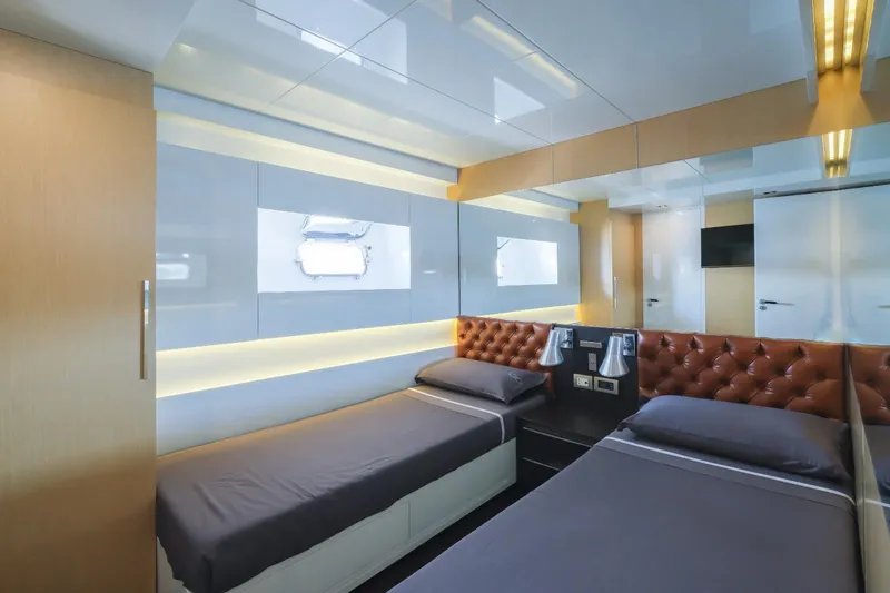 Eternity 44 Yacht Photos Pics Luxurious twin bedroom on 2010 Arcadia Yachts 85, featuring modern design and ambient lighting.