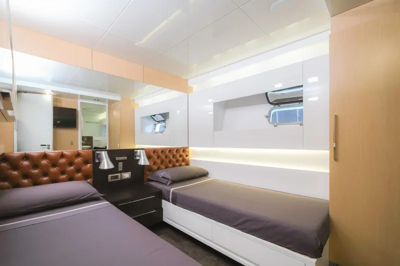 Eternity 44 Yacht Photos Pics Luxurious twin cabin interior on 2010 Arcadia Yachts 85, featuring modern design and ambient lighting.