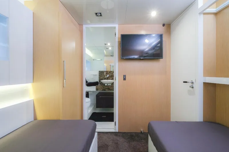 Eternity 44 Yacht Photos Pics Interior of 2010 Arcadia Yachts 85, featuring modern cabin with TV and ensuite bathroom.