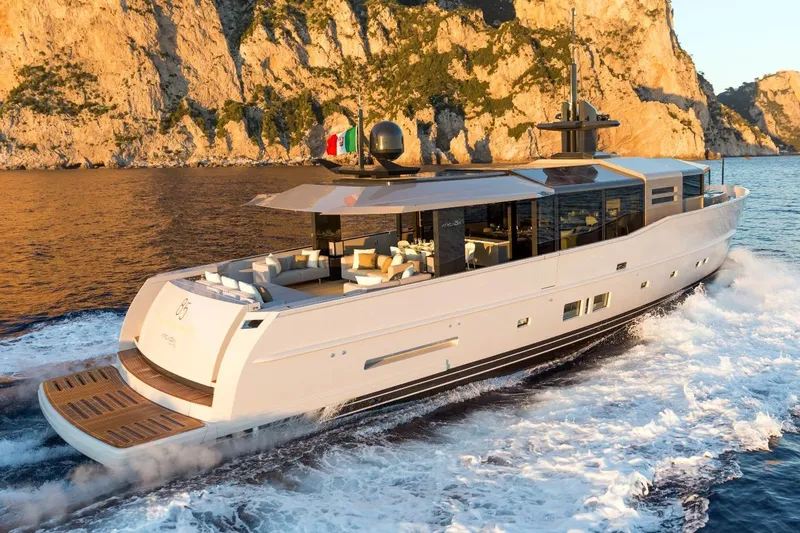 Eternity 44 Yacht Photos Pics Luxury Arcadia Yachts 85 cruising near rocky coastline, 2010 model.