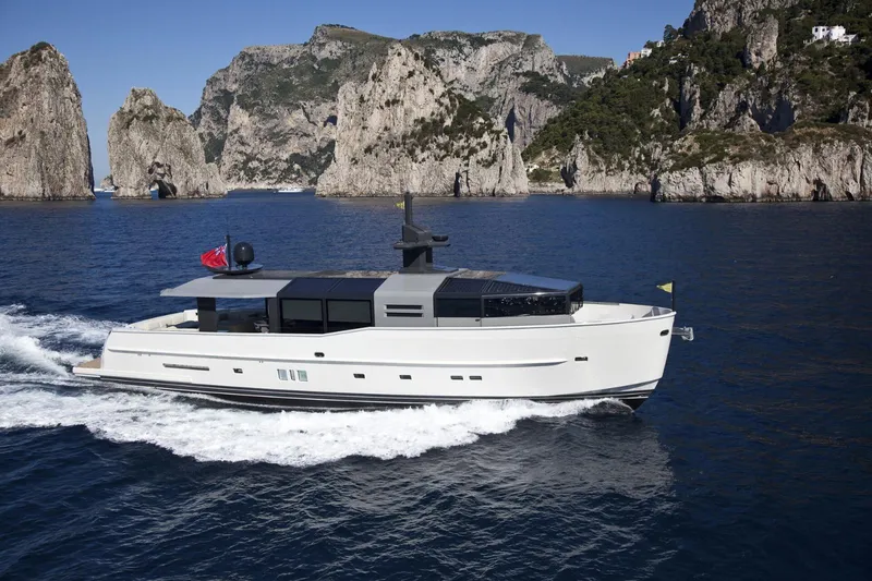 Eternity 44 Yacht Photos Pics Arcadia Yachts 85 cruising near rocky coastline, 2010 model.