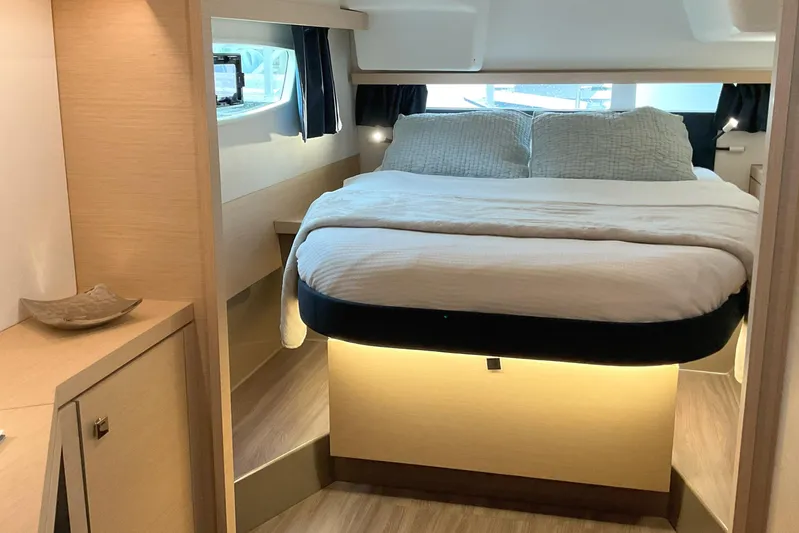  Yacht Photos Pics Luxurious cabin interior of 2017 Fountaine Pajot Lucia 40 catamaran, featuring a cozy bed.