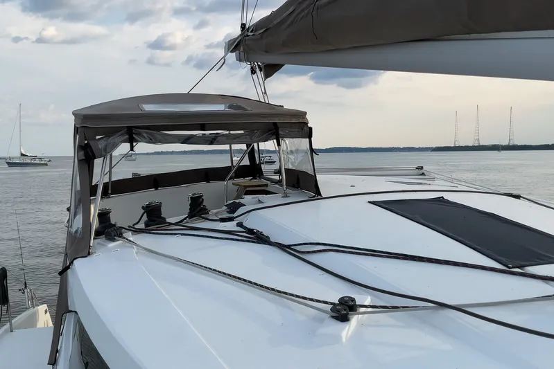  Yacht Photos Pics 2017 Fountaine Pajot Lucia 40 catamaran on calm waters, featuring sleek deck design.