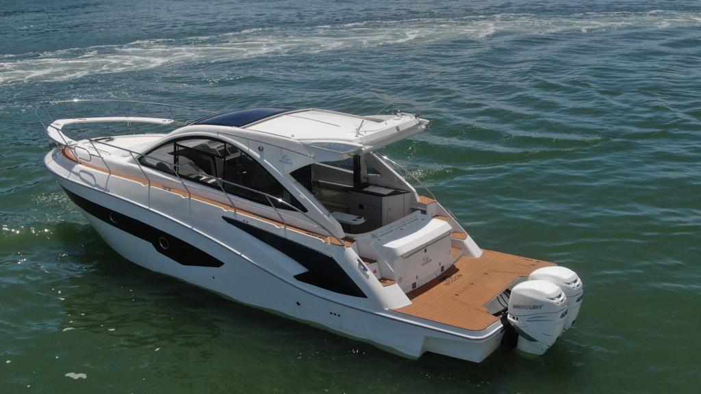 2023 Evolve 400HT luxury boat cruising on open water.
