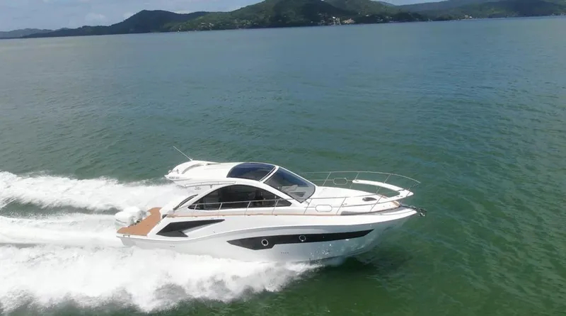 Elena Yacht Photos Pics 2023 Evolve 400HT yacht cruising on open water, showcasing sleek design and performance.