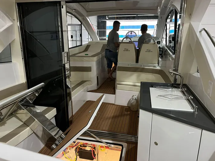Elena Yacht Photos Pics Interior of 2023 Evolve 400HT yacht with modern design and control panel.
