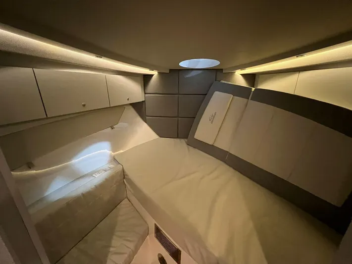 Elena Yacht Photos Pics Luxurious interior cabin of 2023 Evolve 400HT yacht with modern lighting and comfortable bedding.