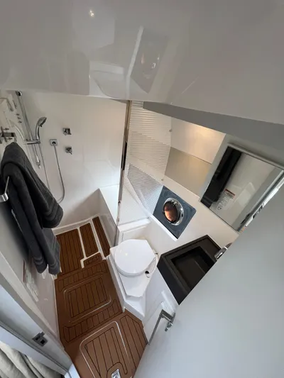 Elena Yacht Photos Pics Modern bathroom in 2023 Evolve 400HT yacht with sleek fixtures and wooden flooring.