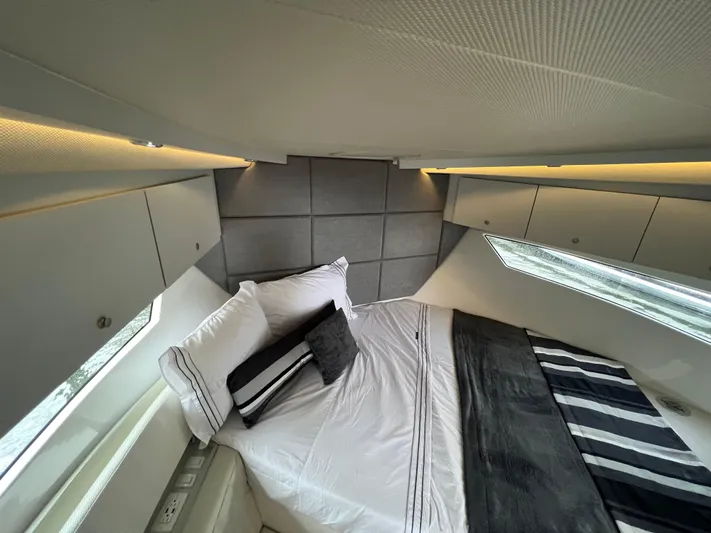 Elena Yacht Photos Pics Luxurious bedroom interior of 2023 Evolve 400HT yacht with modern design and ambient lighting.