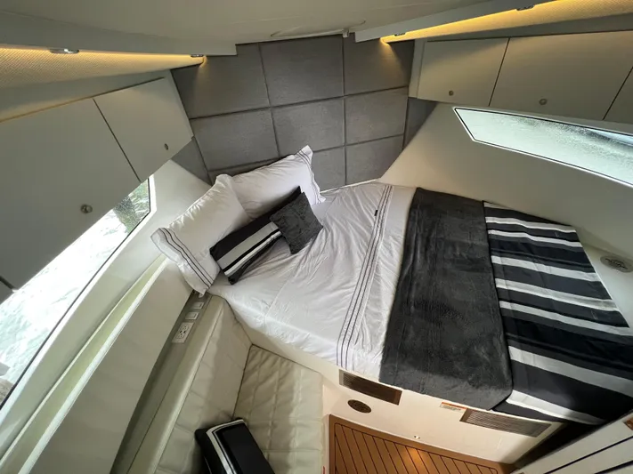 Elena Yacht Photos Pics Luxurious interior cabin of 2023 Evolve 400HT yacht with modern bedding and sleek design.