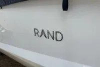 2023 Rand Source 22 boat logo on white surface.