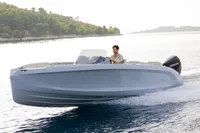 Modern Rand Source 22 boat cruising on a serene lake, 2023 model.
