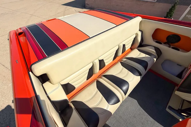  Yacht Photos Pics 2012 DCB 28 Extreme boat interior with vibrant, striped upholstery and spacious seating.