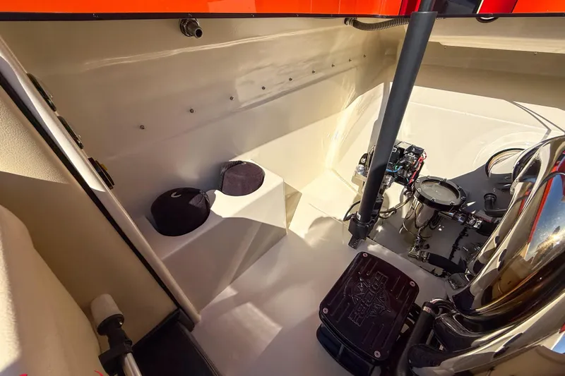  Yacht Photos Pics Interior view of 2012 DCB 28 Extreme boat engine compartment, showcasing mechanical components.