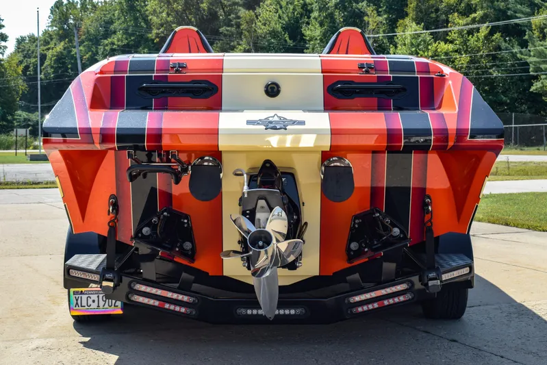  Yacht Photos Pics 2012 DCB 28 Extreme boat, vibrant red and black design, rear view with dual propellers.
