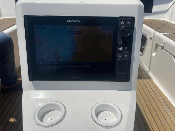 Send Me Yacht Photos Pics Raymarine navigation display on 2018 Dufour 460 Grand Large yacht, with wooden deck background.