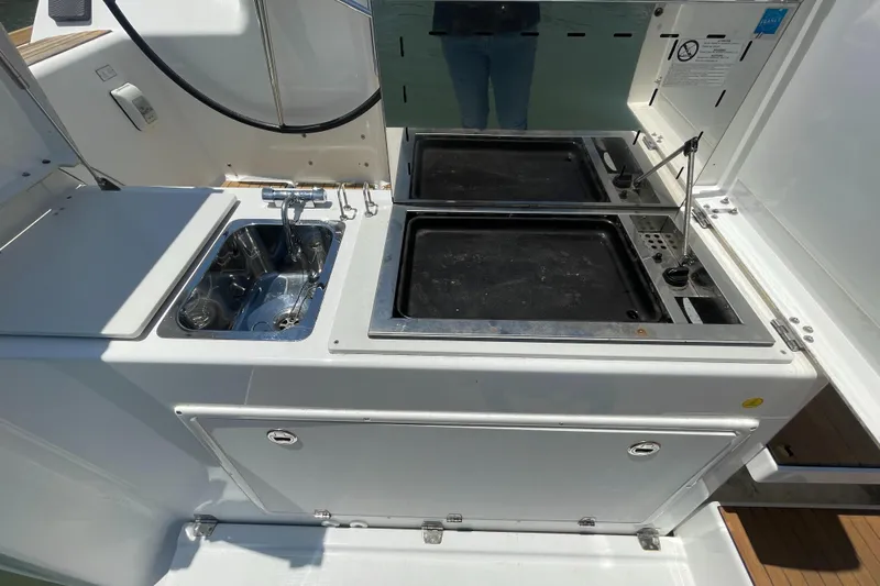 Send Me Yacht Photos Pics Outdoor kitchen on 2018 Dufour 460 Grand Large yacht with sink and grill.