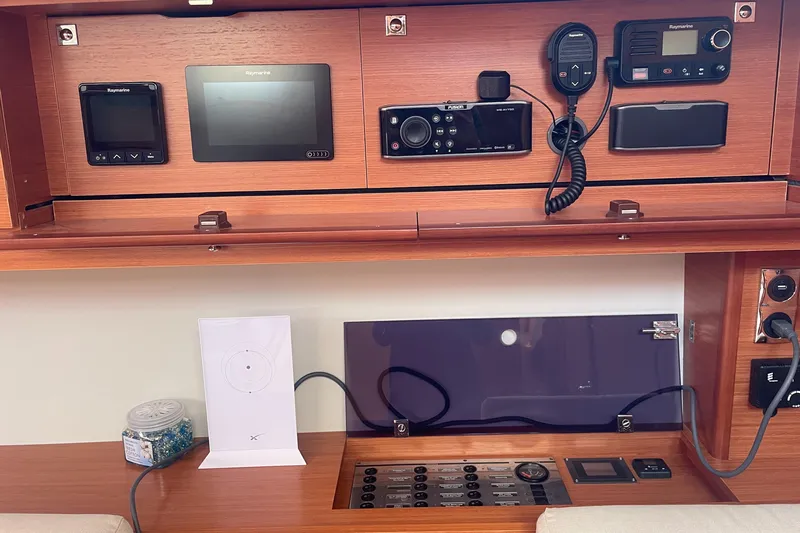 Send Me Yacht Photos Pics Control panel of a 2018 Dufour 460 Grand Large yacht with navigation equipment.
