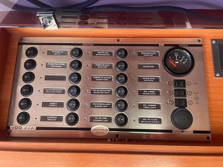 Send Me Yacht Photos Pics Control panel of a 2018 Dufour 460 Grand Large yacht with various switches and gauges.