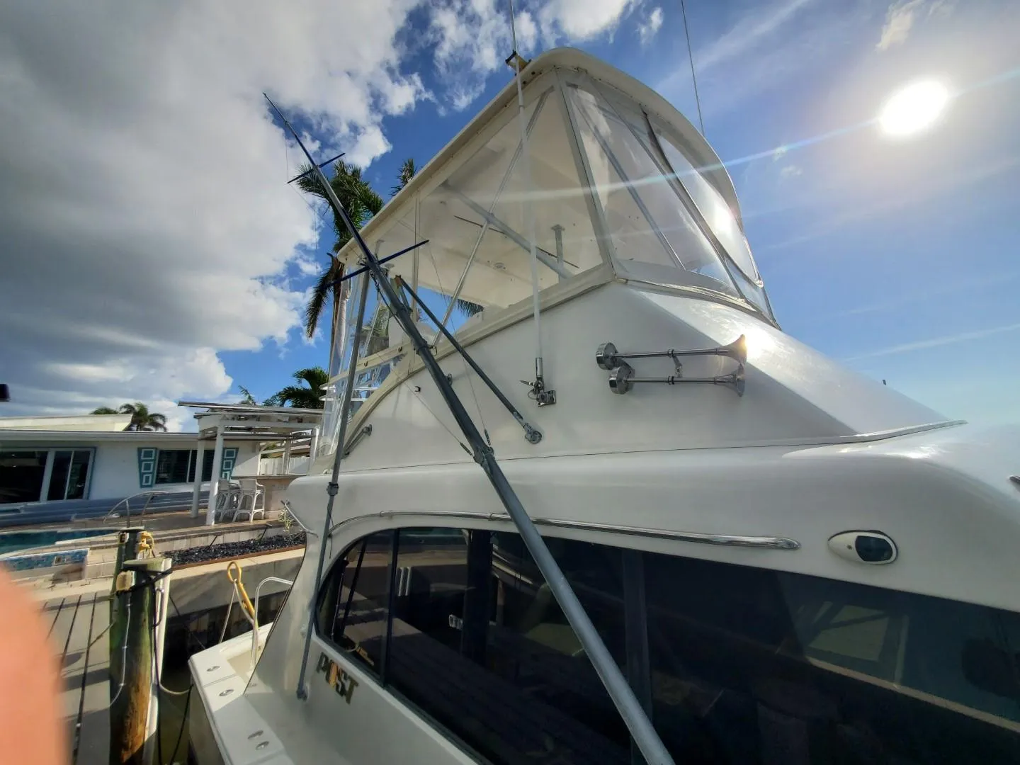 1988 Post 46 Sportfish boat docked under a sunny sky.