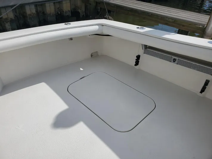Anchor Management Yacht Photos Pics 1988 Post 46 Sportfish boat deck, spacious and clean, with storage hatch.