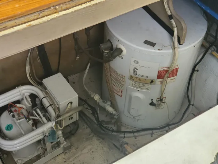 Anchor Management Yacht Photos Pics 1988 Post 46 Sportfish engine room with water heater and electrical components.