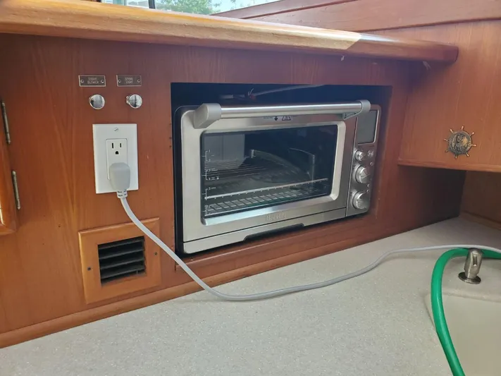Anchor Management Yacht Photos Pics 1988 Post 46 Sportfish kitchen with built-in toaster oven and electrical outlet.