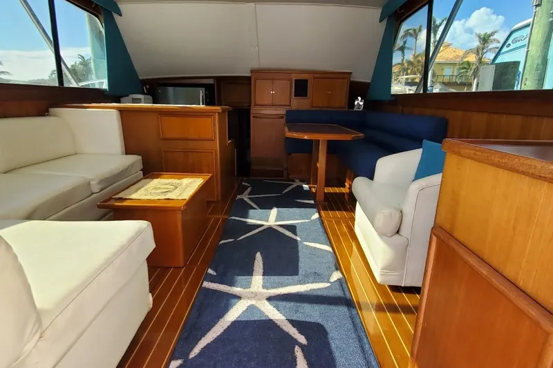 Anchor Management Yacht Photos Pics Interior of 1988 Post 46 Sportfish yacht with elegant seating and nautical decor.