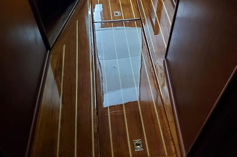 Anchor Management Yacht Photos Pics Polished wooden floor of 1988 Post 46 Sportfish boat interior.
