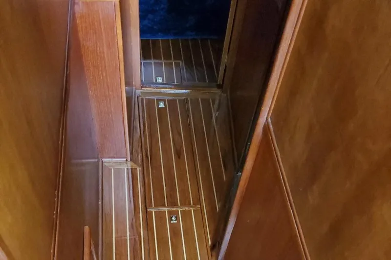 Anchor Management Yacht Photos Pics 1988 Post 46 Sportfish interior with polished wooden flooring and walls.