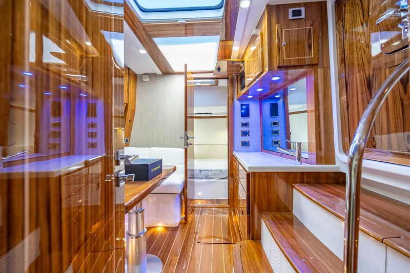  Yacht Photos Pics Luxurious interior of 2026 HCB 65 Estrella yacht with wood finishes and modern amenities.