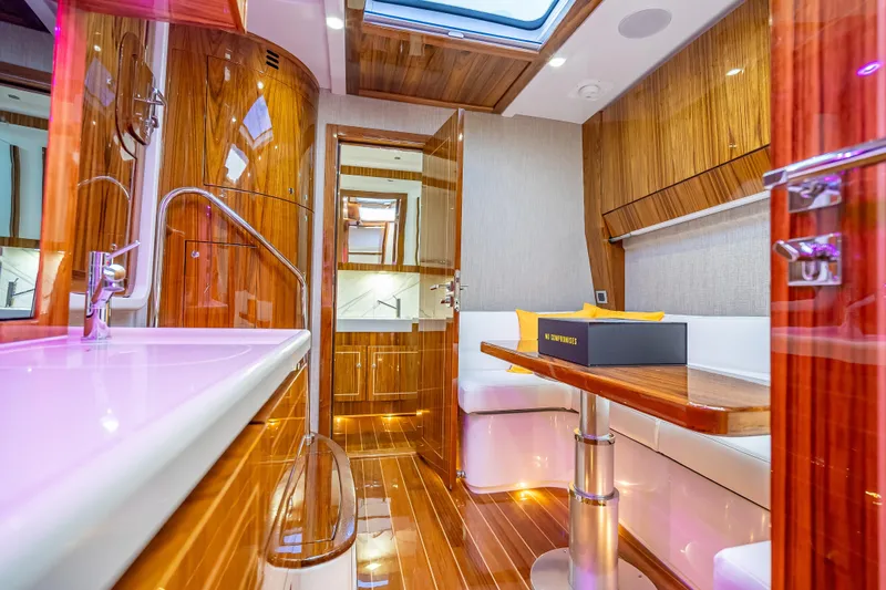  Yacht Photos Pics Luxurious interior of 2026 HCB 65 Estrella yacht with wood finishes and modern amenities.