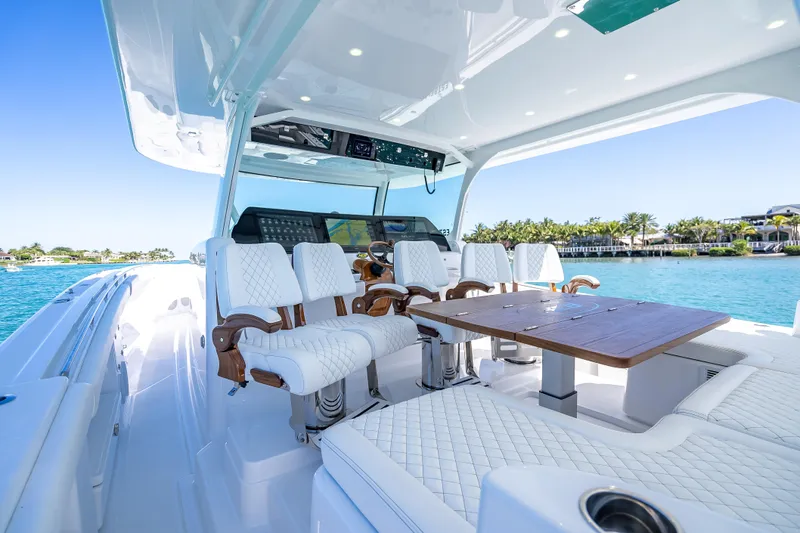  Yacht Photos Pics Luxurious 2026 HCB 65 Estrella yacht interior with elegant seating and ocean view.