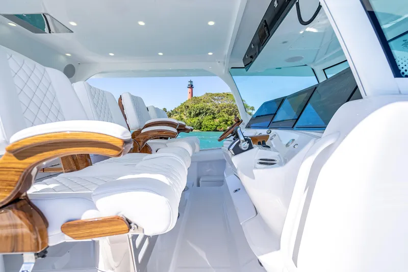 Yacht Photos Pics Interior of 2026 HCB 65 Estrella yacht with luxurious seating and modern dashboard.