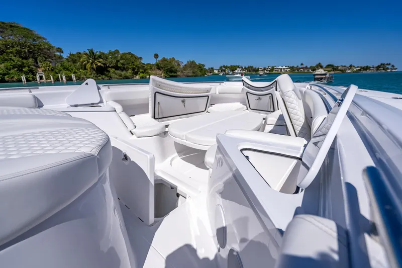  Yacht Photos Pics Luxurious 2026 HCB 65 Estrella boat interior with white seating and scenic ocean view.