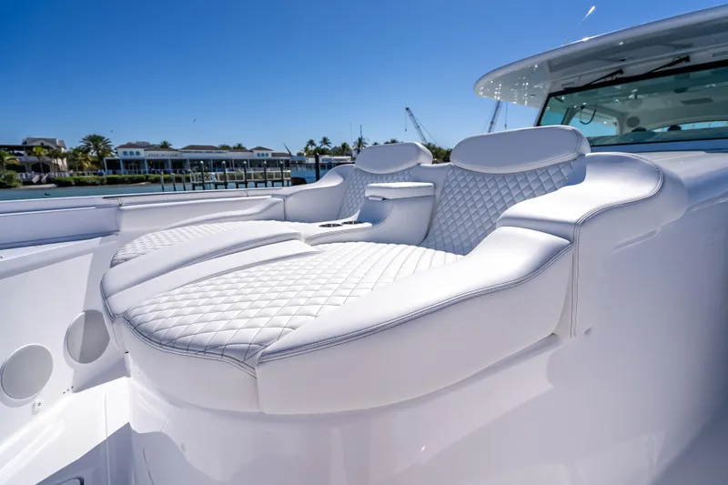  Yacht Photos Pics Luxurious seating on 2026 HCB 65 Estrella yacht with quilted white upholstery.